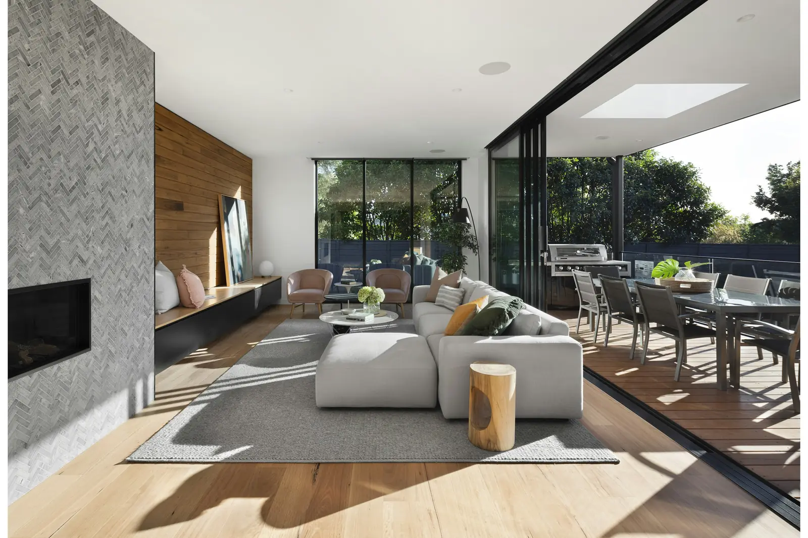 Modern American living room with a light sofa, natural light, and layered textures